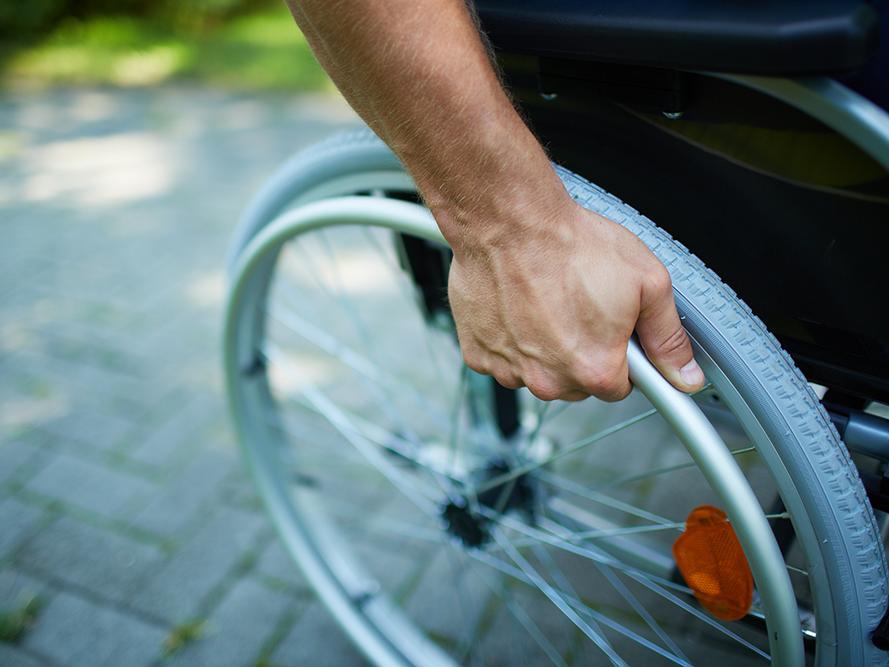 Man Pushing a Wheelchair